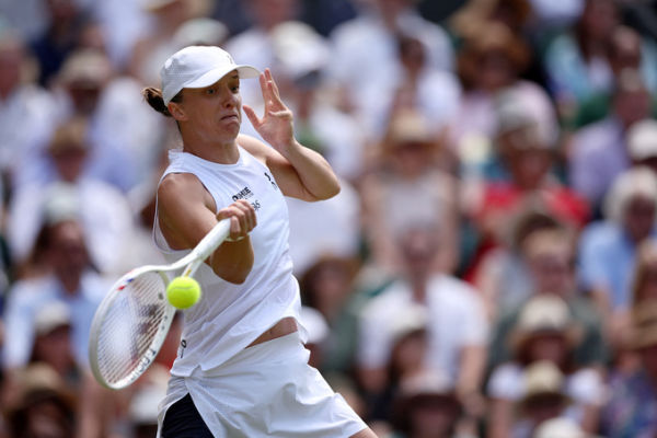 Polands Iga Swiatek returns to Philippines Alexandra Eala during their womens singles third round tennis match on the sixth day of the 2026 Wimbledon Championships at The All England Lawn Tennis and Croquet Club in Wimbledon, southwest London, on July 4, 2026. Photo by AFP