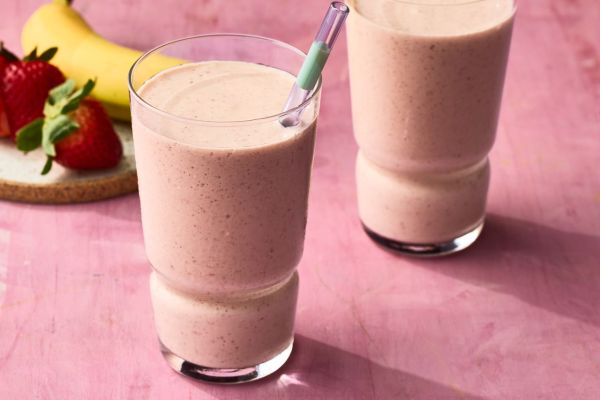 A recipe image of Strawberry–Passion Fruit Smoothie. Credit: Photographer: Greg Dupree, Prop Stylist: Claire Spollen, Food Stylist: Chelsea Zimmer
