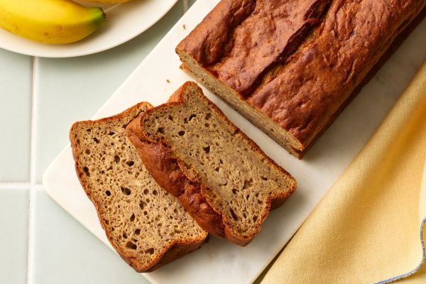 A recipe image of High-Protein No-Added-Sugar Banana Bread. Credit: Photographer: Greg Dupree, Prop Stylist: Claire Spollen, Food Stylist: Chelsea Zimmer