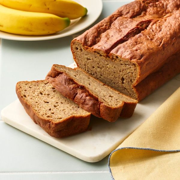 A recipe image of High-Protein No-Added-Sugar Banana Bread. Credit: Photographer: Greg Dupree, Prop Stylist: Claire Spollen, Food Stylist: Chelsea Zimmer