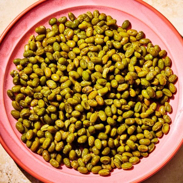 A Recipe Image of Crunchy Roasted Edamame. Credit: Photographer: Morgan Hunt Ward, Prop Stylist: Priscilla Montiel, Food Stylist: Chelsea Zimmer.