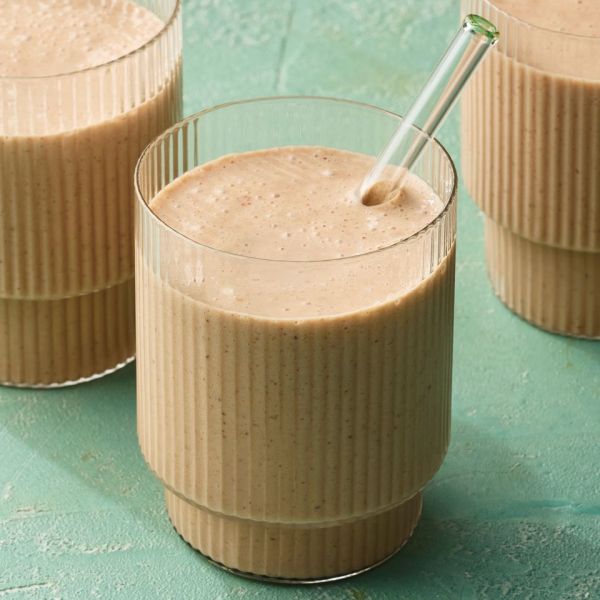 A recipe image of Almond Butter & Chocolate Banana Smoothie Credit: Photographer: Greg Dupree, Prop Stylist: Claire Spollen, Food Stylist: Chelsea Zimmer.