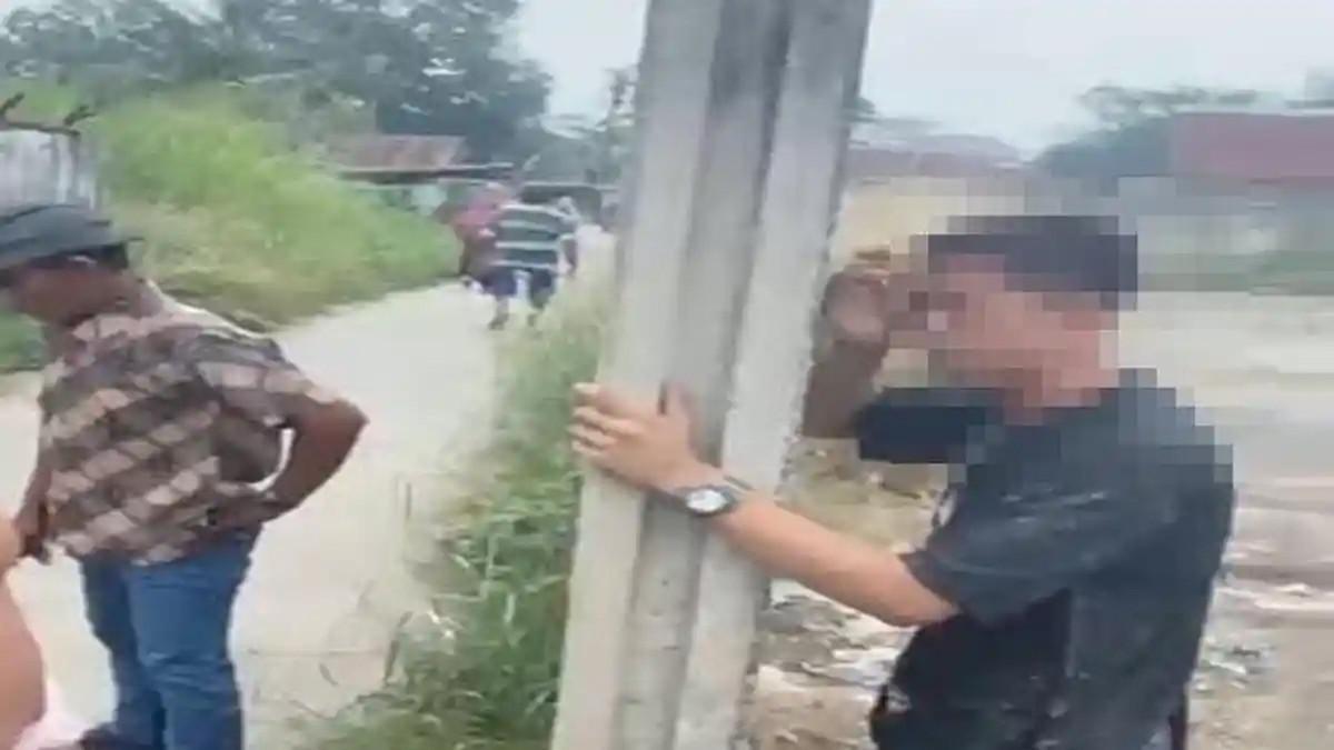 PEMUDA ASUSILA - Pria yang tepergok berbuat asusila di belakang Pasar Buah Jakabaring, Kecamatan Seberang Ulu I, Palembang, pada Rabu (8/7/2026), menangis histeris setelah aksinya dipergoki warga. Pria yang tak diketahui identitasnya itu menangis menolak dinikahkan dengan wanita pasangan mesumnya.