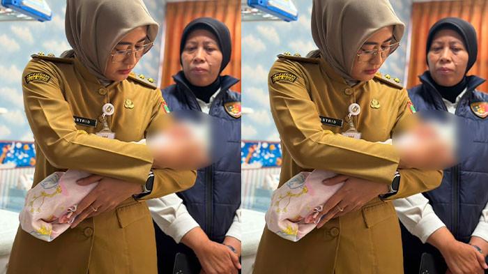 BAYI DITELANTARKAN - Bayi yang ditemukan petugas di toilet KA Sancaka relasi Yogyakarta-Surabaya saat digendong Wakil Wali Kota Solo Astrid Widayani di RS Bhayangkara Solo. Bayi yang diberi nama Bayu Nawasena Bhayangkara itu diduga baru berusia seminggu atau beberapa hari pasca dilahirkan.