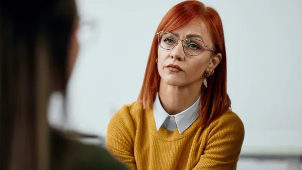woman talking to colleague expressing disappointment and understanding