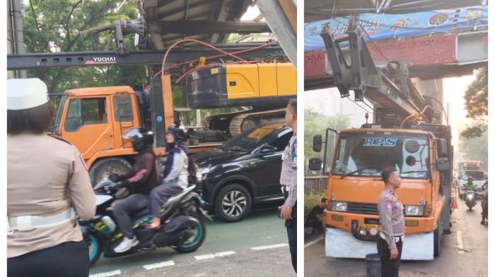 TRUK TERSANGKUT JPO - Lalu lintas di Jakarta diwarnai peristiwa truk crane tersangkut Jembatan Penyeberangan Orang (JPO) di Jalan Kapten Tendean, Mampang Prapatan, Jakarta Selatan, Selasa (14/7/2026) dini hari. Simak lima temuan terkait peristiwa itu.