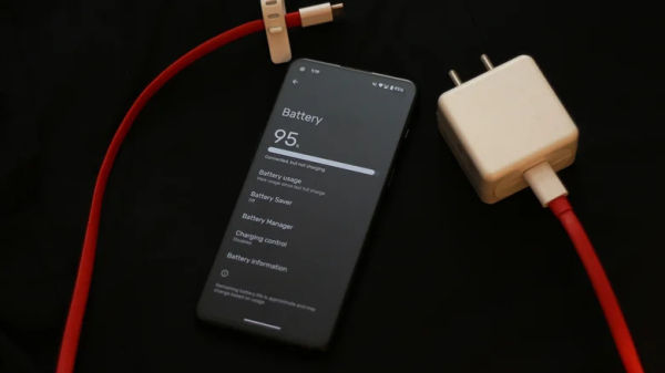 Phone next to its charging adapter