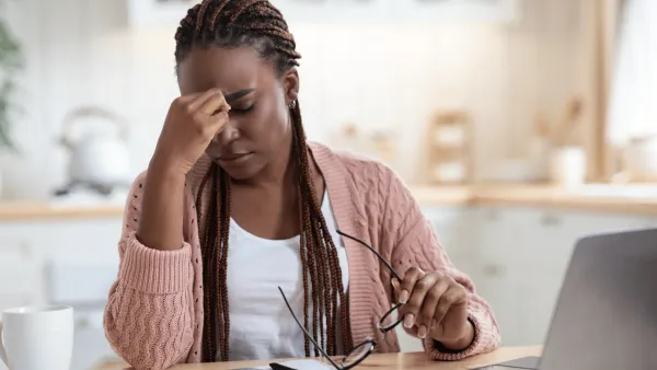 stressed woman thinking she has too much going on