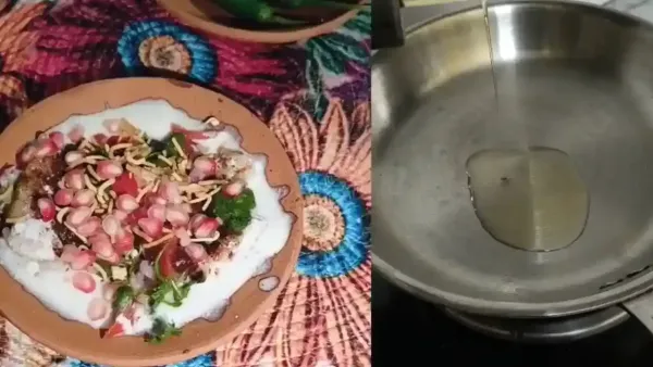 Delicious sweet potato chaat with yogurt and pomegranate toppings prepared in a shiny stainless steel frying pan.