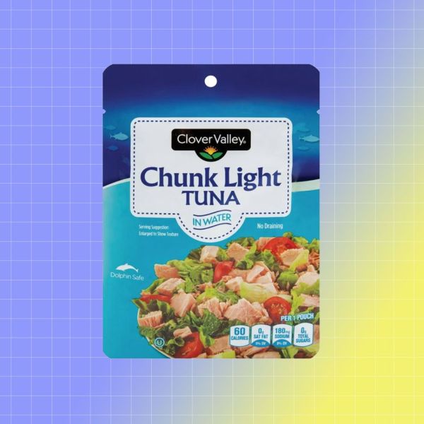Clover Valley Chunk Light Tuna in packaging against a gradient background Credit: Dollar General. EatingWell design.