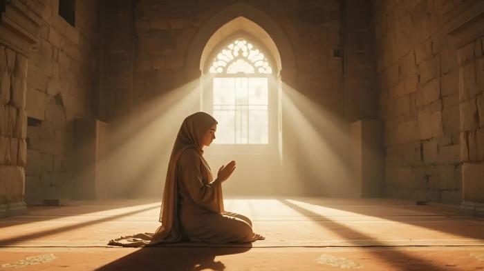 BERDOA- Seorang wanita muslim menengadahkan kedua tangannya berdoa kepada Allah S.W.T agar mendapat keridaan selama hidup di dunia.