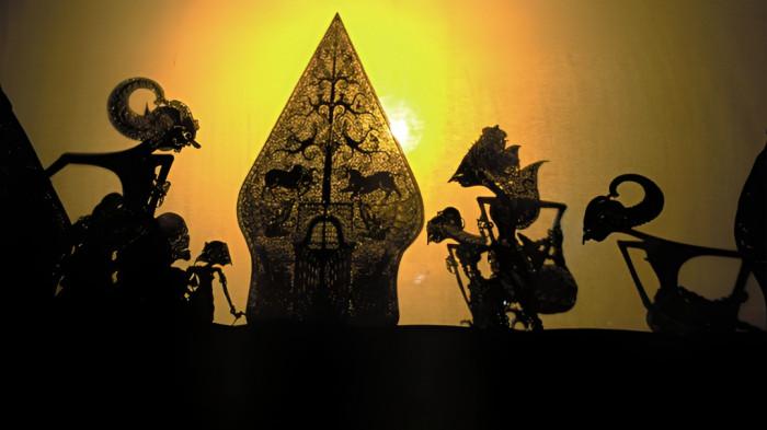 WAYANG KULIT- Ilustrasi pertunjukan wayang kulit yang merupakan tradisi dan peninggalan masyarakat Jawa.