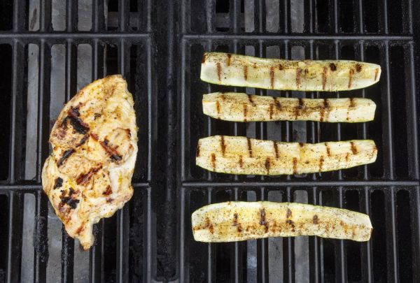 Grilled chicken breast and zucchini slices on a grill Credit: Abbey Littlejohn