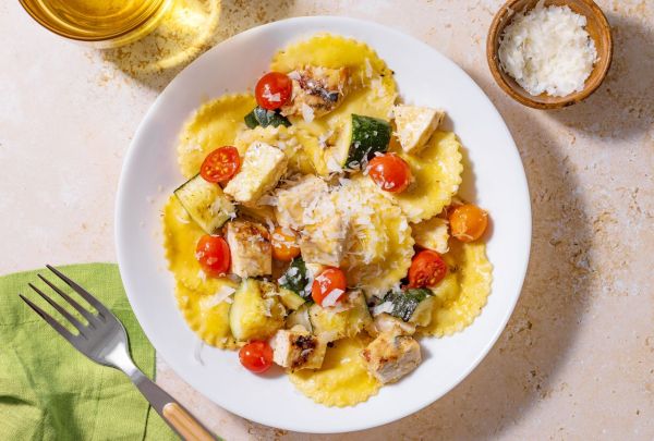 Plate of ravioli topped with vegetables and grated cheese Credit: Abbey Littlejohn