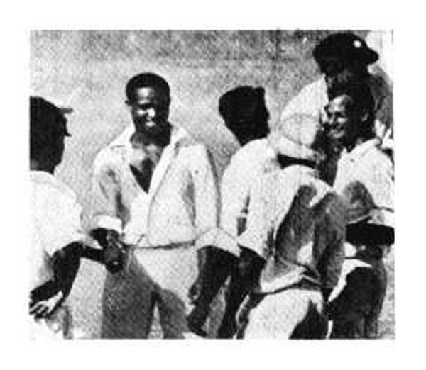 The first player to get 4,000 runs and 100 wickets in Test history, Sobers gets a round of accolades from teammates for taking his 100th wicket (Peter Philpott) at Kingston, 1965. The Windies beat Aussies, their first win against them in a home series.