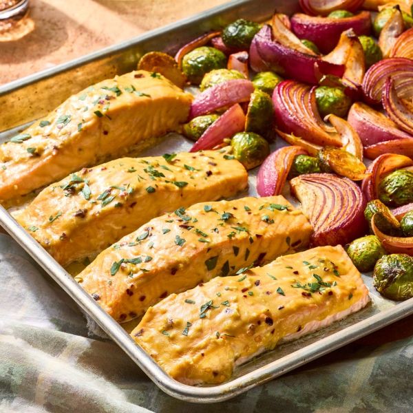 an image of the Sheet-Pan Honey Mustard Salmon & Vegetables Credit: Photographer: Hannah Hufham, Food Stylist: Giovanna Vazquez