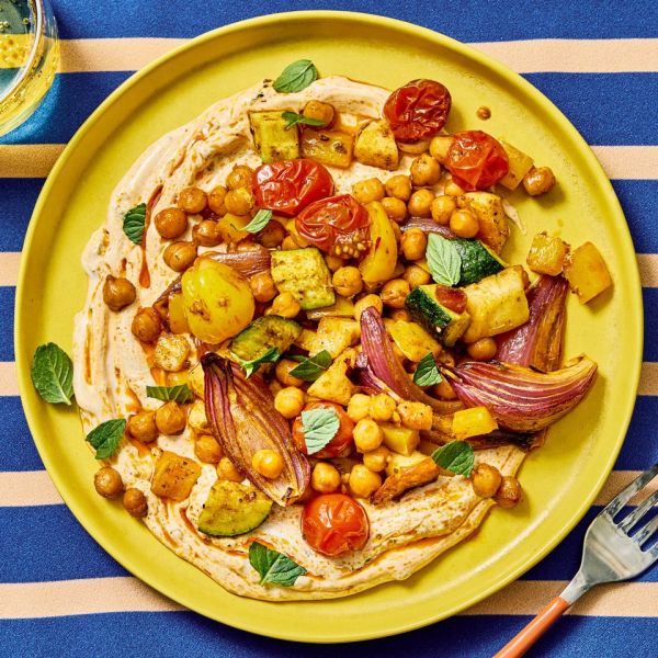 an image of the Sheet-Pan Halloumi with Roasted Chickpeas & Veggies Credit: Photographer: Morgan Hunt Glaze, Prop Stylist: Claire Spollen, Food Stylist: Chelsea Zimmer