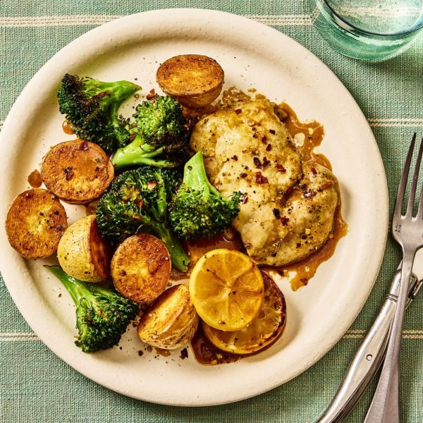 A recipe image of Sheet-Pan Lemon-Pepper Chicken Thighs with Broccoli & Potatoes. Credit: Photographer: Morgan Hunt Ward, Prop Stylist: Priscilla Montiel, Food Stylist: Chelsea Zimmer.