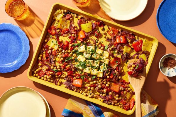 a recipe photo of the Sheet-Pan Baked Feta, Bell Peppers, Red Onion, Cherry Tomatoes & Chickpeas Credit: Photographer: Brie Goldman, Food Stylist: Addelyn Evans, Prop Stylist: Gabriel Greco