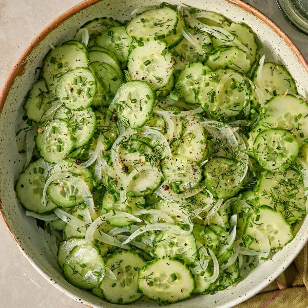 Recipe image of Easy Marinated Cucumbers Credit: Photographer: Jen Causey, Food Stylist: Julian Hensarling, Prop Stylist: Christina Daley.