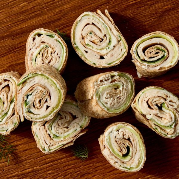 Recipe image of Turkey, Cucumber & Cream Cheese Roll-Ups Credit: Photographer: Jen Causey, Food Stylist: Margaret Monroe Dickey, Prop Stylist: Hannah Greenwood.