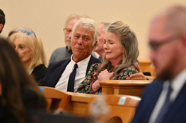 Attorney Larry Stein (L) and Melissa Gilbert, wife of director and actor Timothy Busfield, react after a judge granted Busfield a pre-trial release during a hearing in the Second District Judicial Court at the Bernalillo County Courthouse on January 20, 2026 in Albuquerque, New Mexico. Prosecutors have charged Busfield with two counts of criminal sexual contact of a minor and one count of child abuse. (Photo by Sam Wasson/Getty Images)
