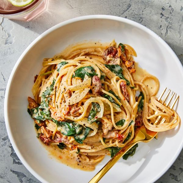 Spaghetti & Spinach with Sun-Dried Tomato Cream Sauce (tk final title) Credit: Photography / Kelsey Hansen, Styling / Greg Luna