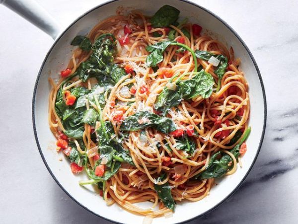 One-Pot Pasta With Spinach and Tomatoes in a pot Credit: Caitlin Bensel