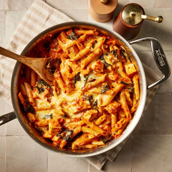 overhead view of cheesy chicken pasta bake in a pan Credit: Photographer: Jen Causey, Food Stylist: Torie Cox, Prop Stylist: Claire Spollen