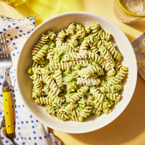 Overhead view of a bowl of Creamy Green Pea Pesto Pasta recipe Credit: Photographer: Jen Causey, Food Stylist: Melissa Gray, Prop Stylist: Shell Royster