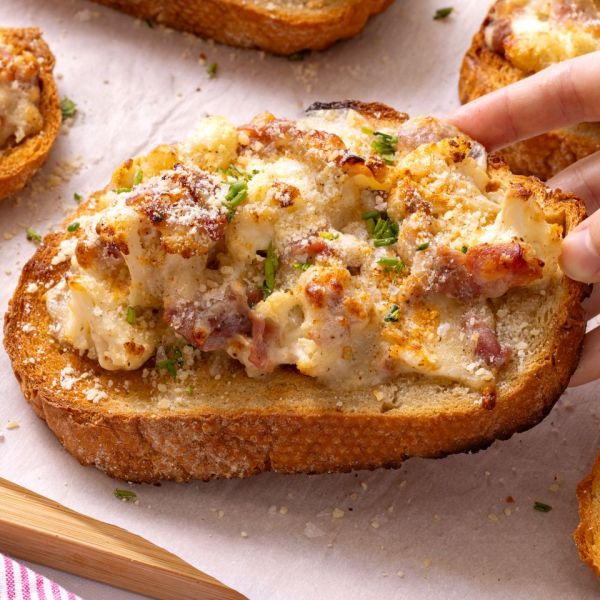 Low angle photo of Ina Garten's cauliflower toast being picked up Credit: Abbey Littlejohn