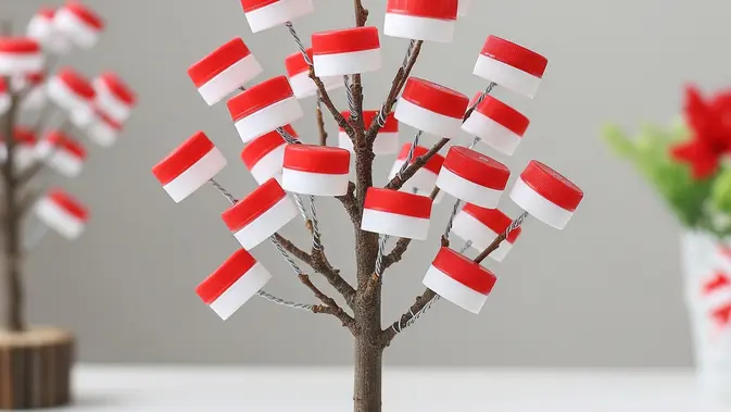 Pohon Bendera Mini dari Ranting dan Tutup Botol Bekas (AI Generated)
