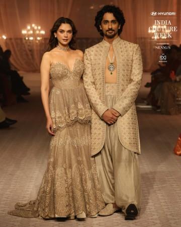 Aditi Rao Hydari looks sensuous in bralette-style lehenga; Siddharth flaunts abs in unbuttoned kurta; couple gets romantic on runway