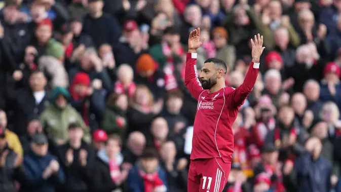 Mohamed Salah merayakan gol kedua Liverpool dalam laga Premier League melawan Fulham, Sabtu (11/4/2026). (AP Photo/Jon Super)
