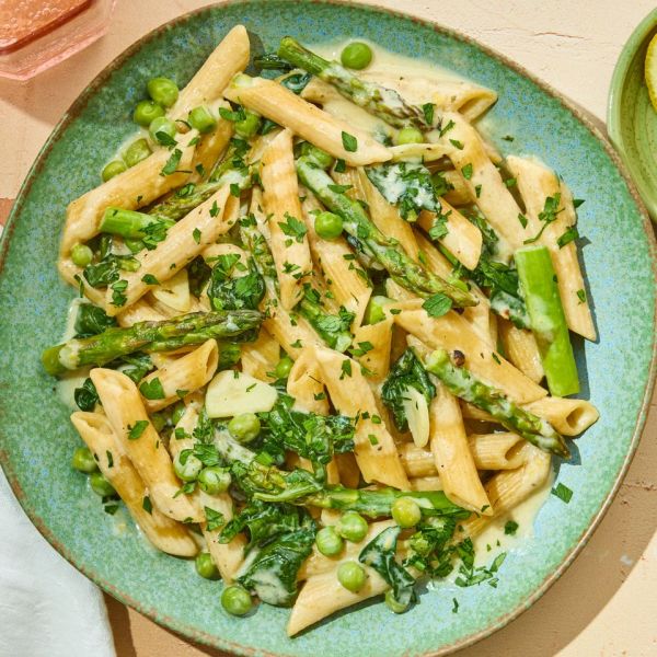 A recipe image of Baked Lemon-Boursin Pasta with Spring Vegetables Credit: Photographer: Stacy Allen, Food Stylist: Margaret Dickey, Prop Stylist: Josh Hoggle.