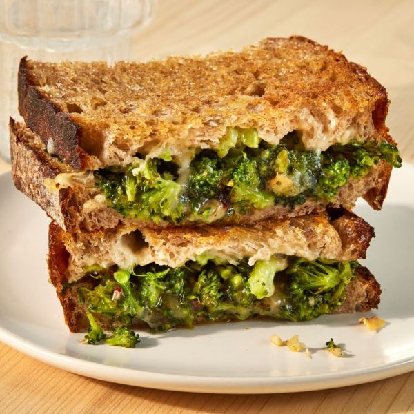 an image of the Broccoli Melt sliced on a plate Credit: Photographer: Jen Causey, Food Stylist: Emily Nabors Hall, Prop Stylist: Julia Bayless