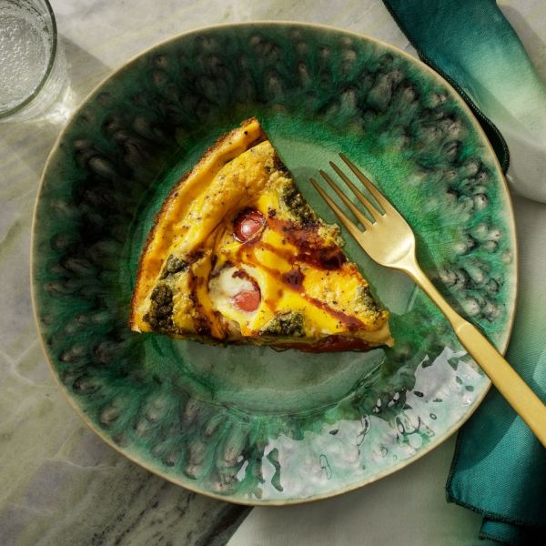 a recipe photo of the Crustless Caprese Quiche Credit: Photographer: Fred Hardy, Food Stylist: Jennifer Wendorf, Prop Stylist: Lydia Purcell