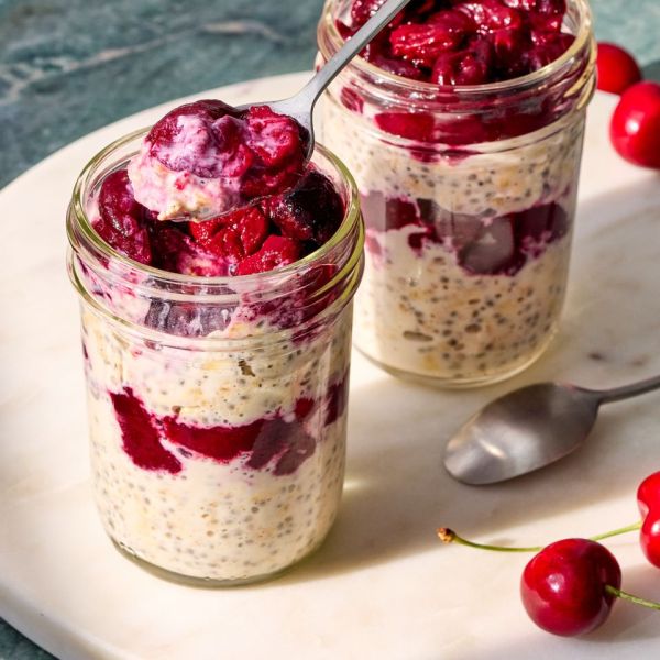 A recipe image of Cherry Pie Overnight Oats. Credit: Photographer: Grant Webster, Food Stylist: Holly Dreesman, Prop Stylist: Dera Burreson.
