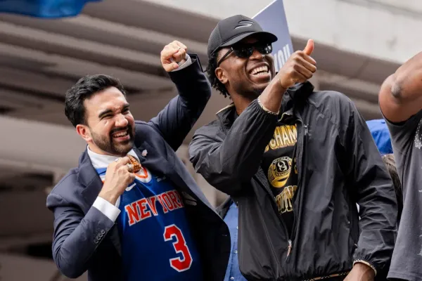 New York City Mayor Zohran Mamdani and Knicks forward OG Anunoby celebrate on a float during the championship ticker tape parade on June 18, 2026 in New York City.
