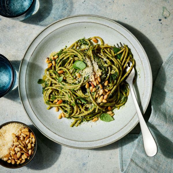 a recipe photo of the Super Green Pasta served on a plate and topped with pine nuts and cheese Credit: Photographer: Jen Causey, Food Stylist: Margret Monroe Dickey, Prop Stylist: Christine Keely
