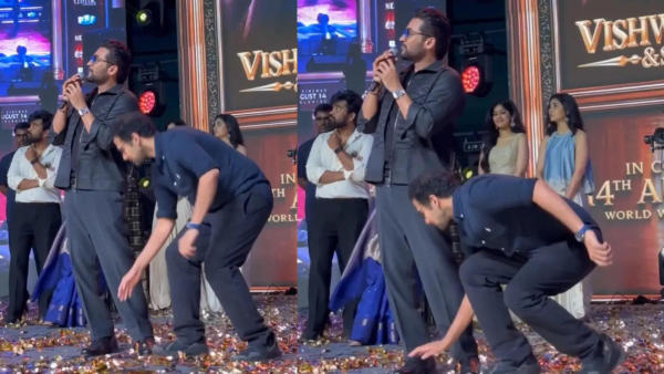 Venky Atluri Touches Suriya's Feet At Vishwanath And Sons Event