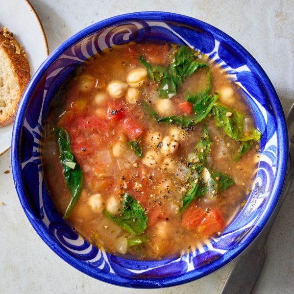 Recipe image of Easy Mediterranean Chickpea & Spinach Soup Credit: Photographer: Carson Downing, Food Stylist: Annie Probst, Prop Stylist: Megan Miller.