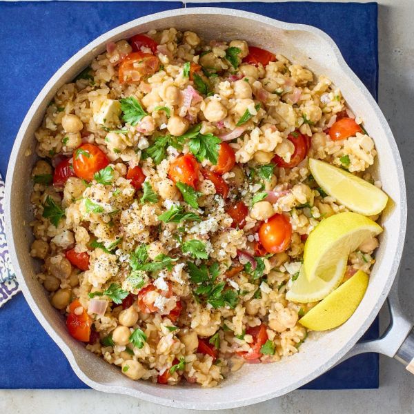 A recipe image of One-Skillet Mediterranean Lemon Chickpea Rice Credit: Photographer: Carson Downing, Food Stylist: Annie Probst, Prop Stylist: Megan Miller.