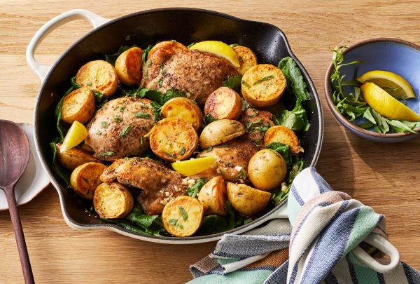 Skillet Lemon Chicken & Potatoes with Kale Credit: Photographer: Victor Protasio, Food Stylist: Margaret Dickey, Prop Stylist: Claire Spollen