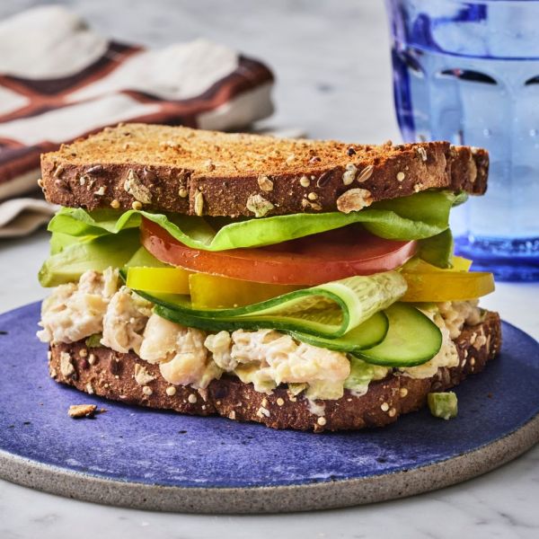A recipe image of Cucumber & White Bean Sandwich Credit: Photographer: Greg Dupree, Prop Stylist: Julia Bayless, Food Stylist: Chelsea Zimmer.