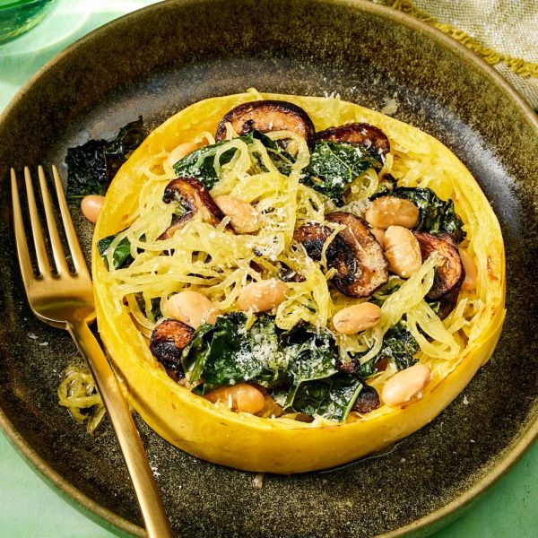 an image of the Spaghetti Squash Nests with Kale, White Beans & Mushrooms Credit: Photographer: Robby Lozano, Food Stylist: Emily Nabors Hall, Prop Stylist: Lydia Pursell