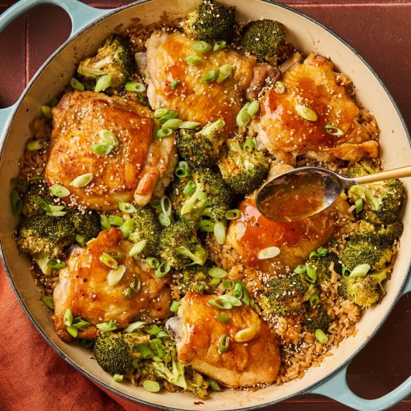 an overhead image of the Orange Chicken & Broccoli Skillet Credit: Photographer: Greg DuPree, Food Stylist: Chelsea Zimmer, Prop Stylist: Hannah Greenwood