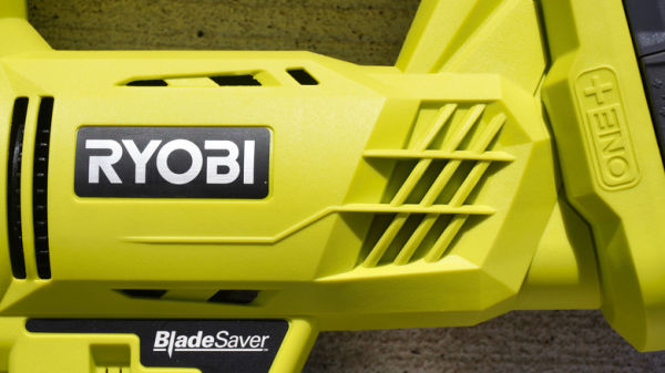 Close up of a Ryobi jigsaw body with the Ryobi logo prominent