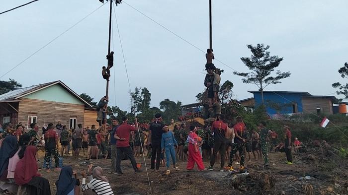 Perlombaan yang digelar di Markas Yonif TP 922/UT Desa Maning