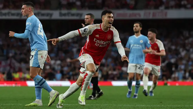 Gabriel Martinelli mencetak gol tunggal kemenangan Arsenal atas Manchester City pada laga pekan kedelapan Premier League di Stadion Emirates, Minggu (8/10/2023) malam WIB. (AFP/Adrian Dennis)